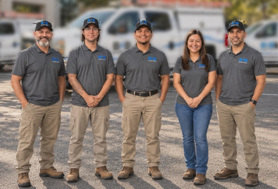 The B&B Electric team in front of company service trucks